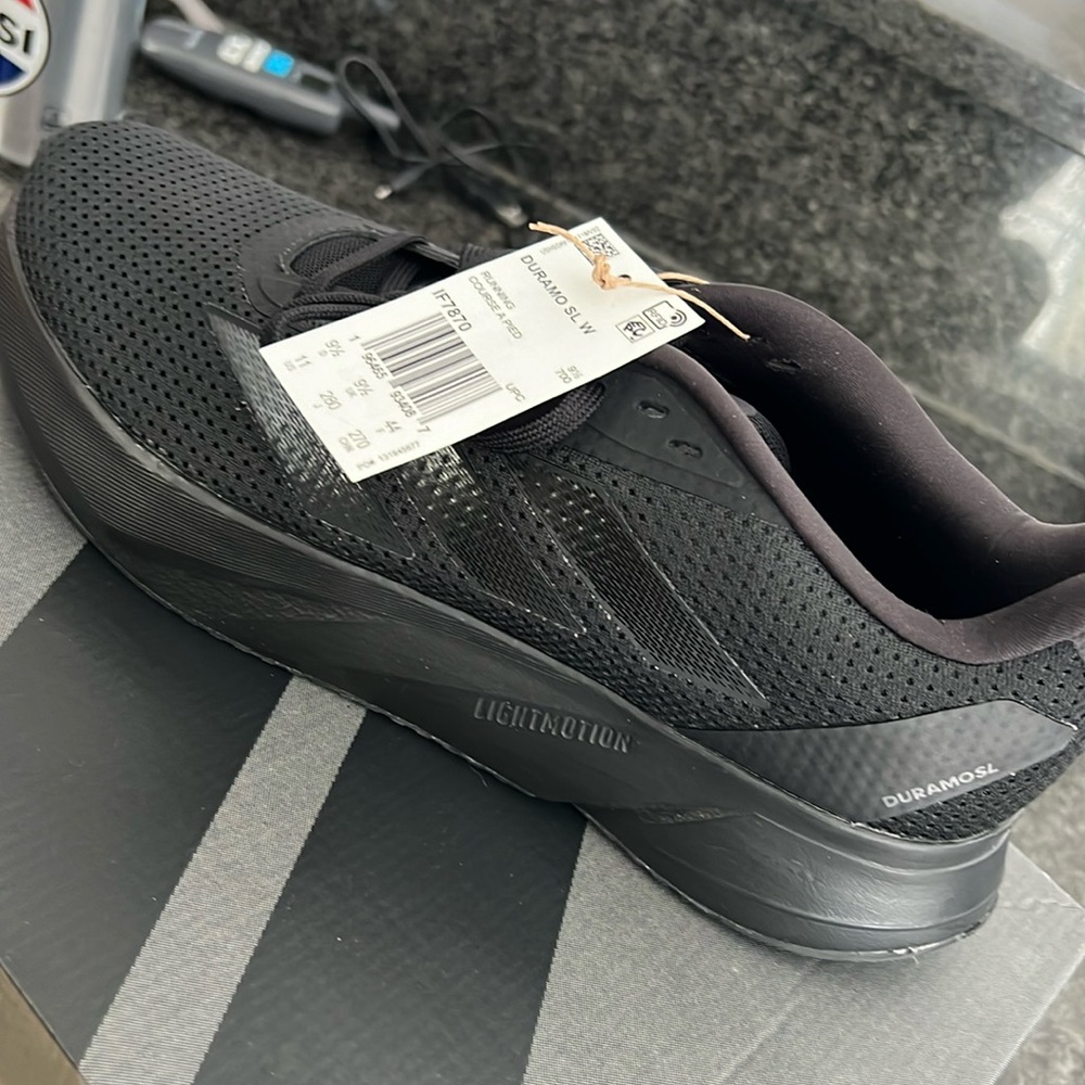 Woman’s black running sneakers. New in box.